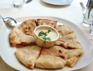 At Tamarind Tribeca, na’an bread with a yogurt mint sauce as condiment.