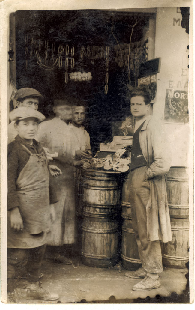 The first little store opened in 1920 on Retsinas Street in Peraeus by the three Loumidis brothers. Jason Loumidis, father of Sotiris Loumidis, at right.